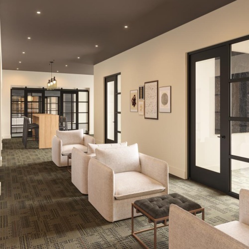 a private lounge area with white chairs