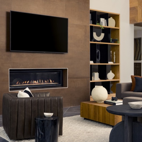 clubhouse interior featuring seating, tv and a fire place