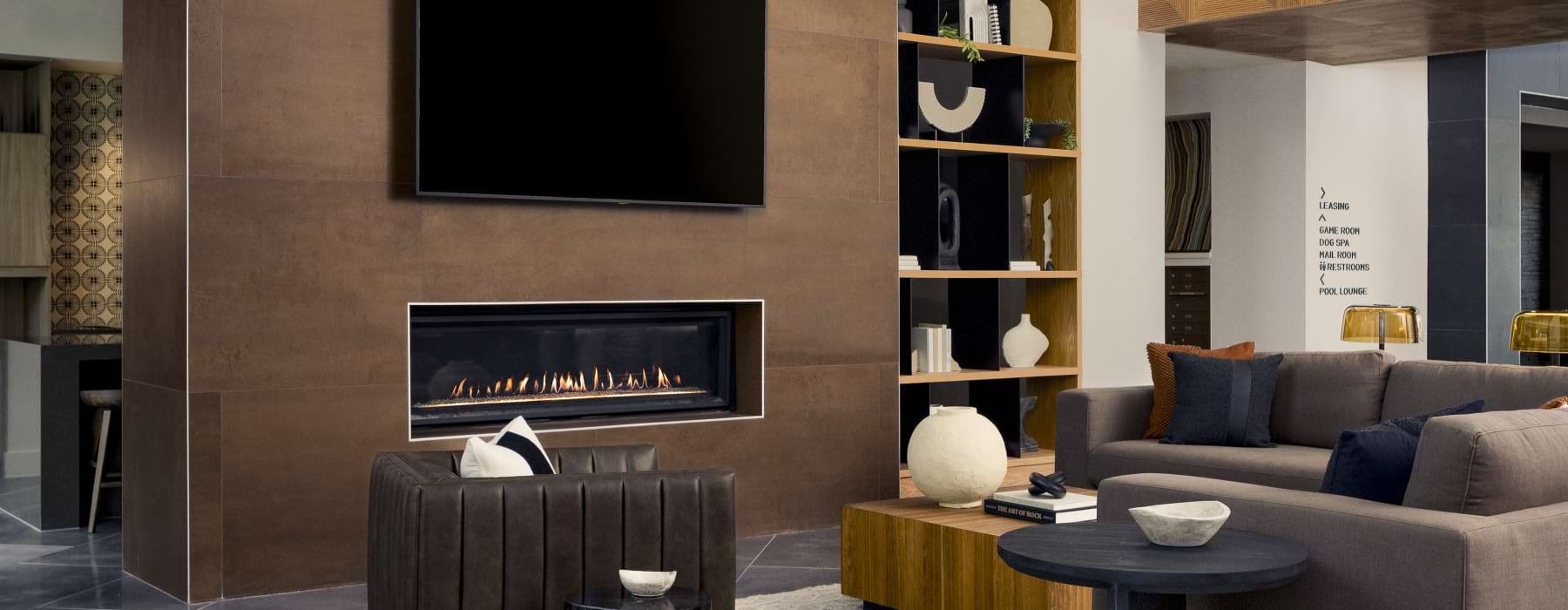 clubhouse interior featuring seating, tv and a fire place