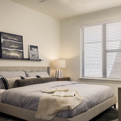 Bedroom wtih large bed and end tables