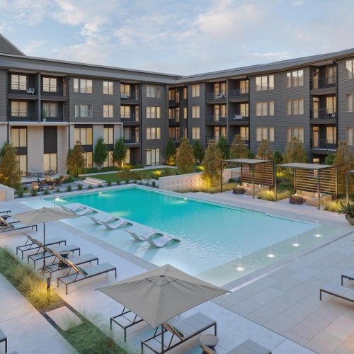 a swimming pool in front of a building