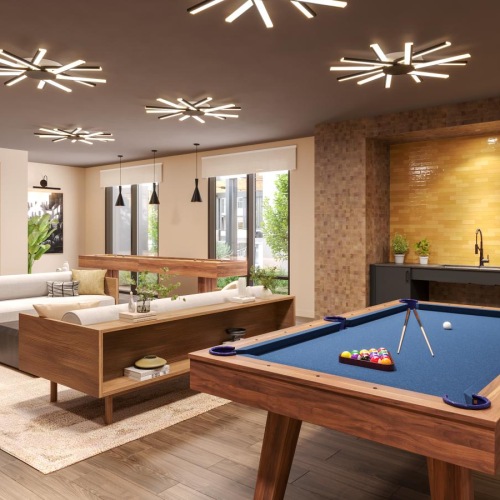 a room with a pool table and couches and a billiards
