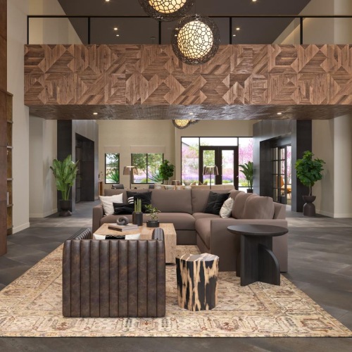 a living room with a large chandelier and a large rug and a fire place