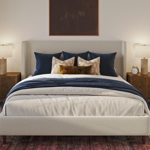 a bedroom with a large bed and a rug